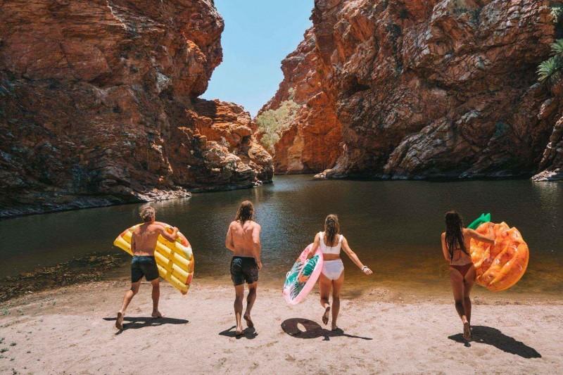 Group of people about to go swimming in Central Australia