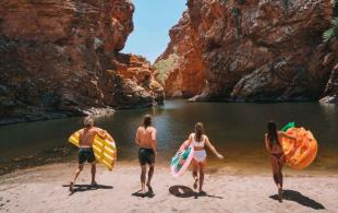 Group of people about to go swimming in Central Australia