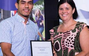 Student receiving award