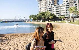 Girls walking on beach