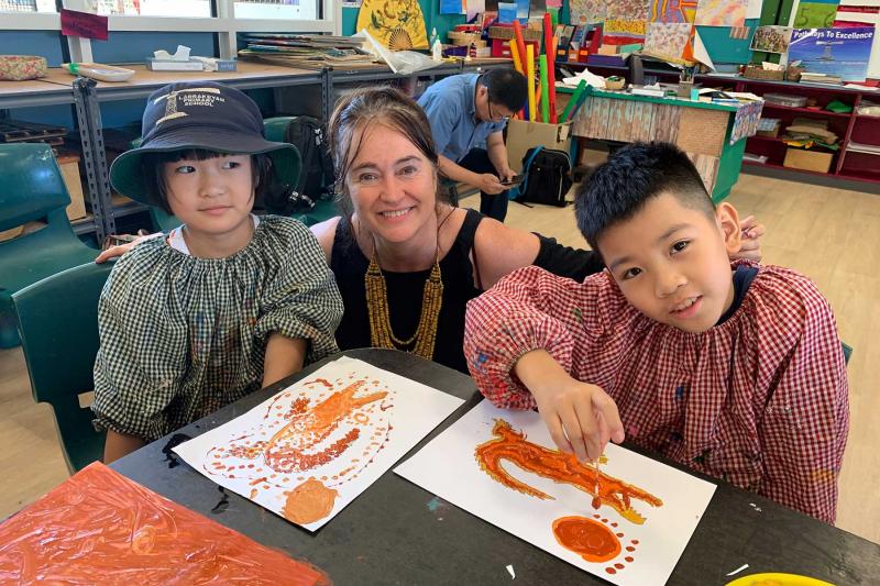 Teacher and student during art lessons at Larrakeyah Primary