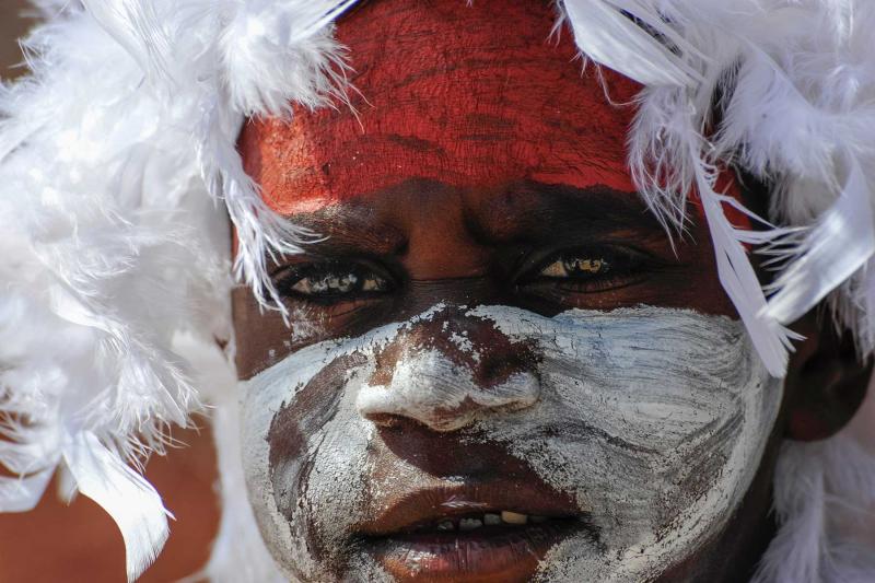 Close up of Aboriginal child's face with body art