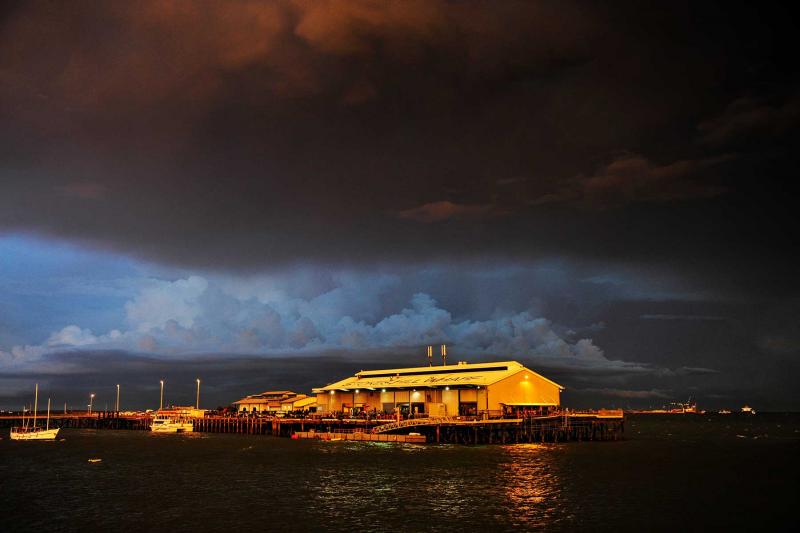 Stokes Hill Wharf jetting at night with storm brewing